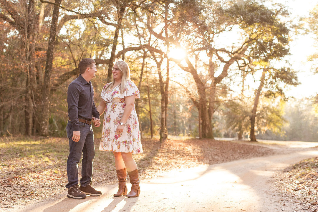 The couple walks down the road at Blakeley State Park in Spanish Fort, Alabama.