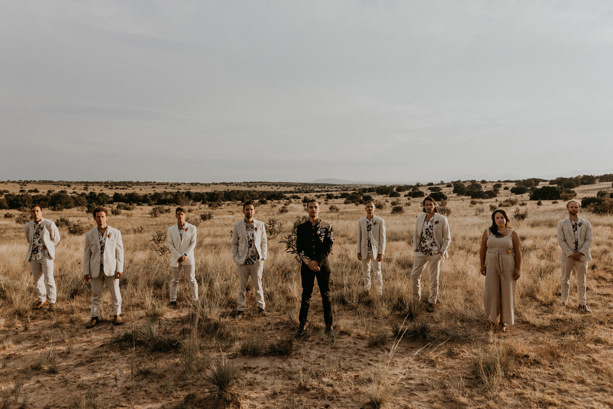 groom and his wedding party in the desert