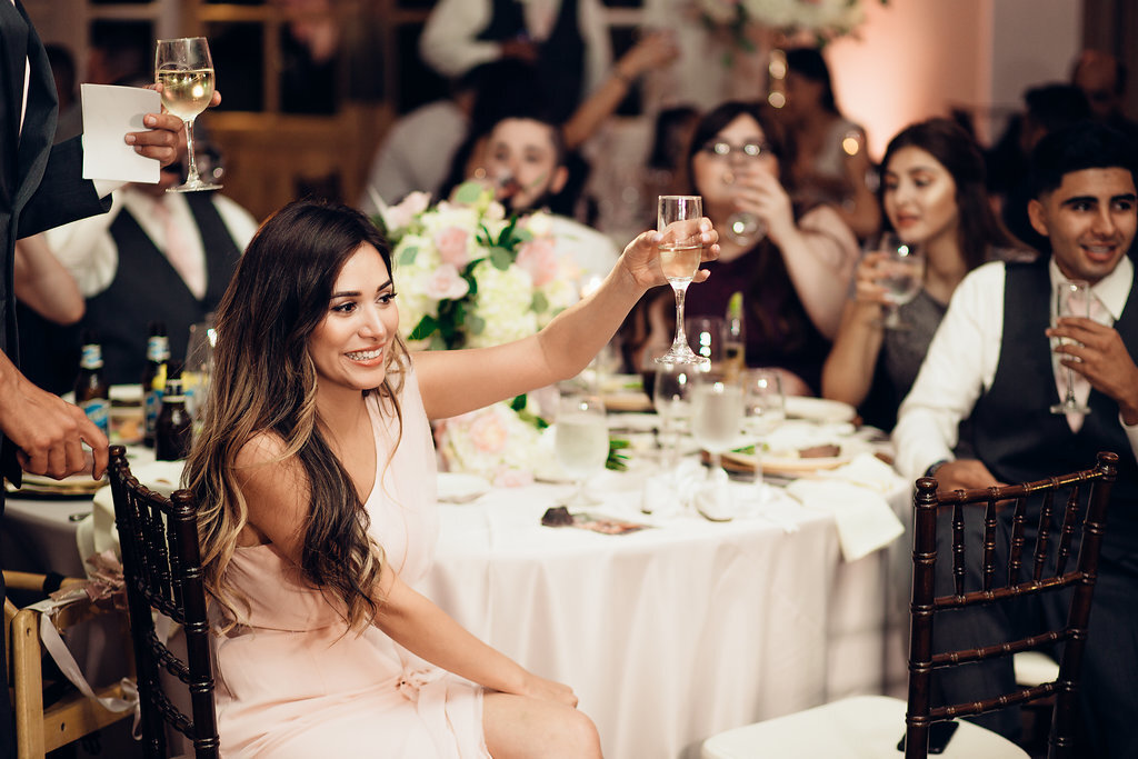 Wedding Photograph Of Visitors Raising The Wine Glasses Los Angeles