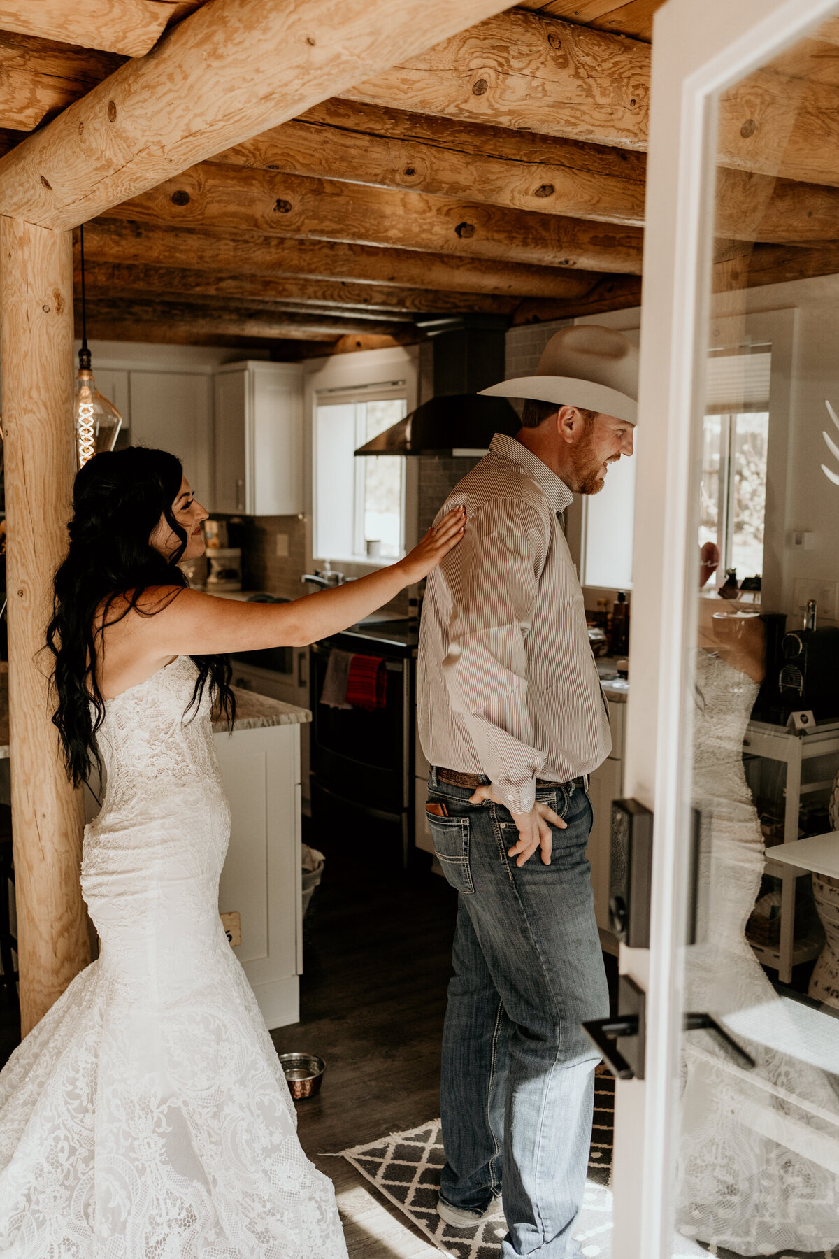 bride and groom having a first look in a cabin