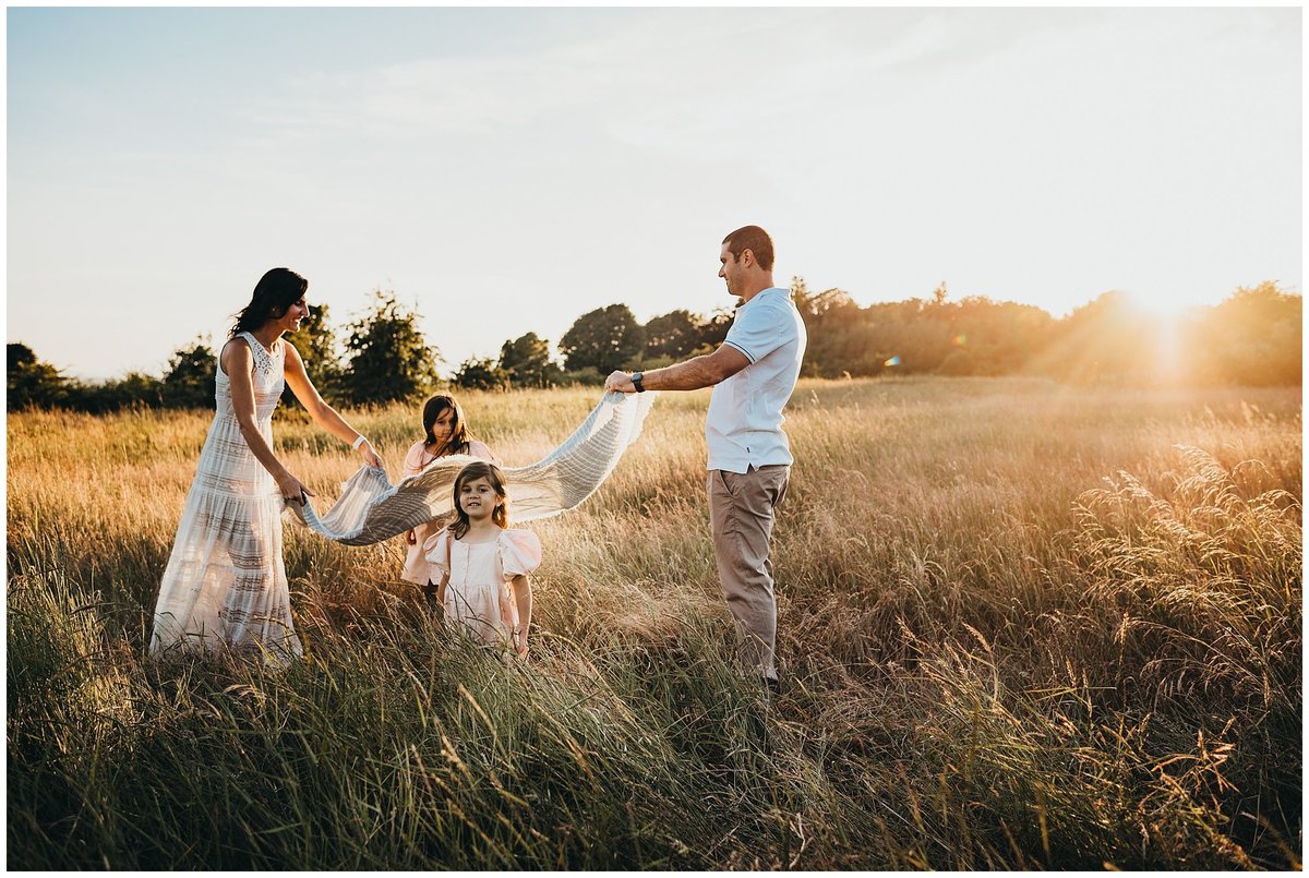 Family playing in field at sunset Emily Ann Photography Seattle Photographer