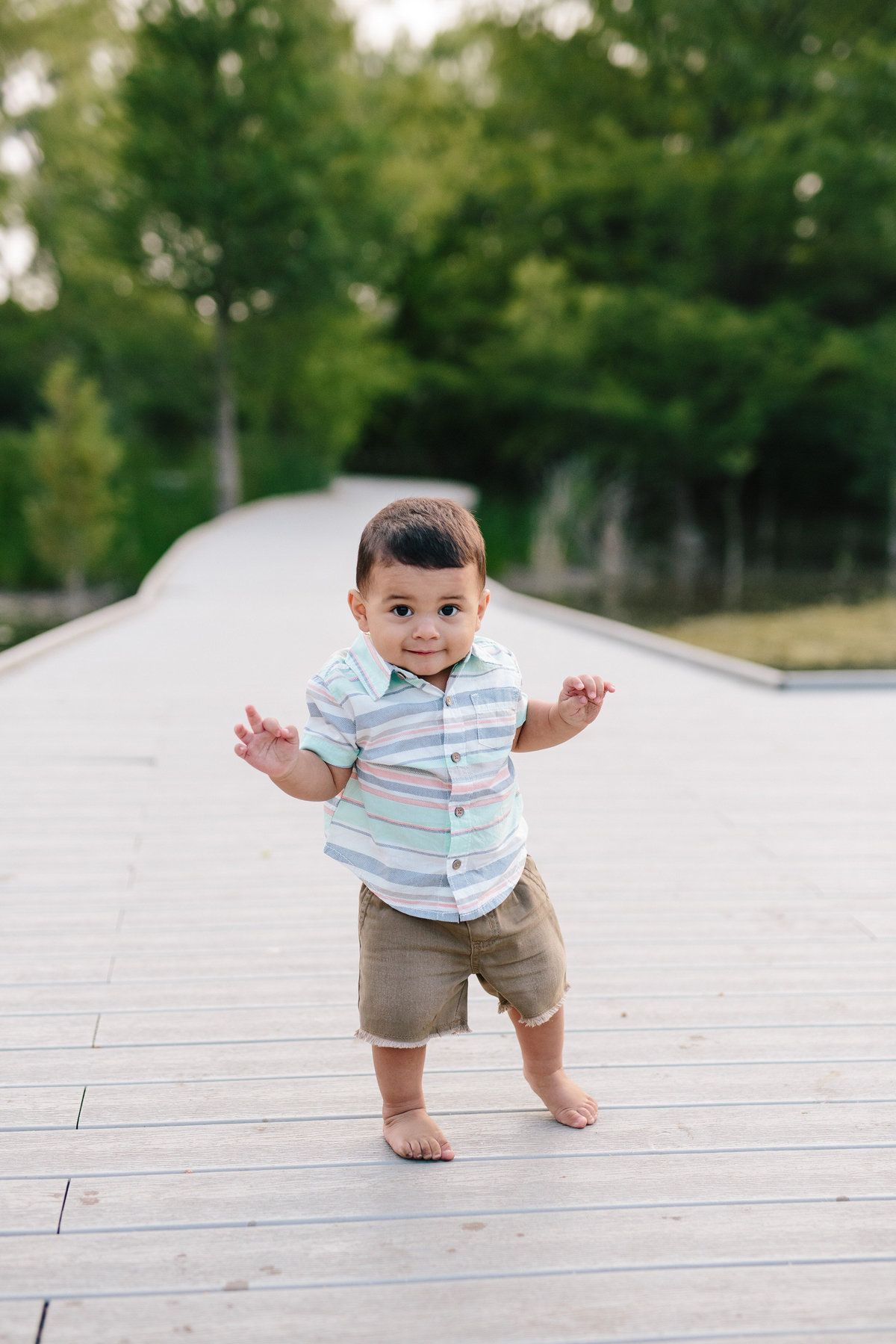 boy walking on pier for family photography session taken by San Antonio Photographer Expose The Heart Photographer