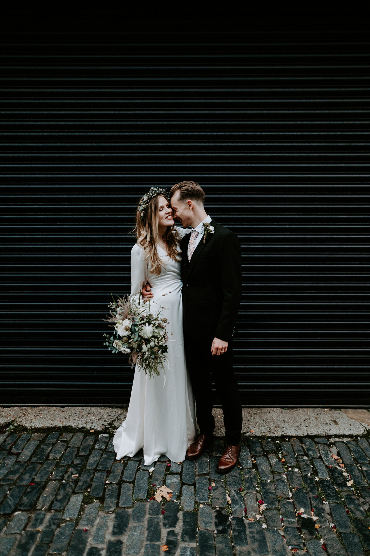 Clapton Country Club has some cool places for couples portraits. Black shutters and white brick walls are just some of the cool photo spots. The ceremony has some amazing natural light which is perfect for summer weddings.