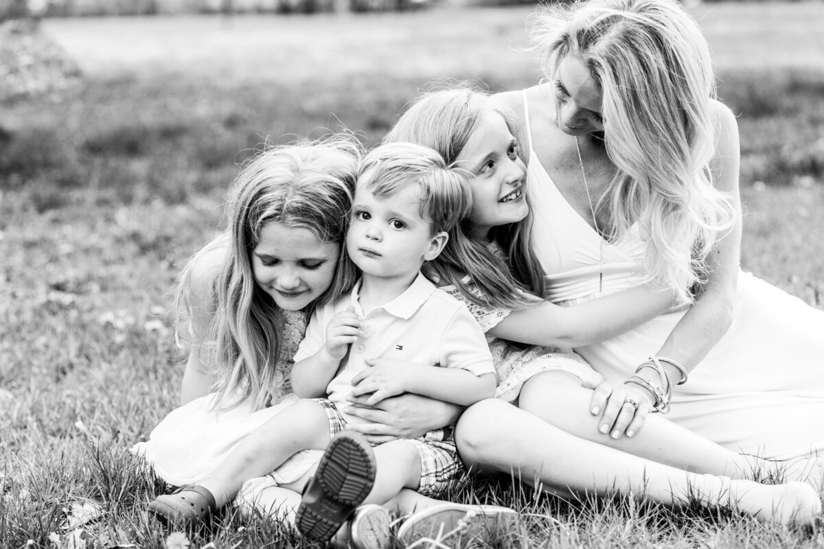 Black and White Image of Mother with  three young children  in Westfield, NJ park