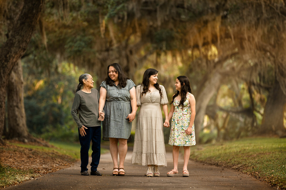 Four generation of beautiful ladies posing together for their Generations photoshoot for Mother's Day with Houston motherhood photographer Danielle Dott Photography