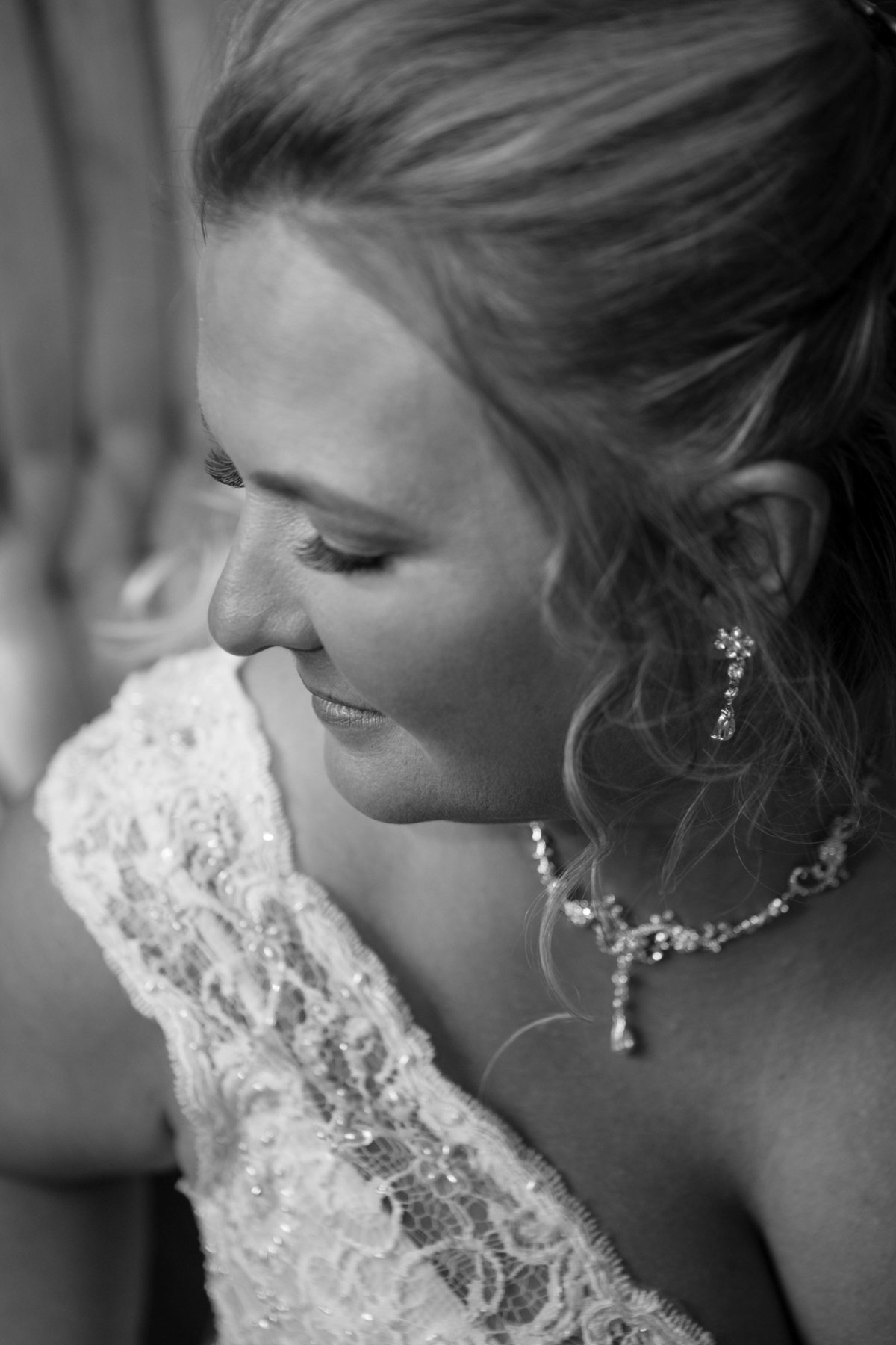 earrings and necklace on bride