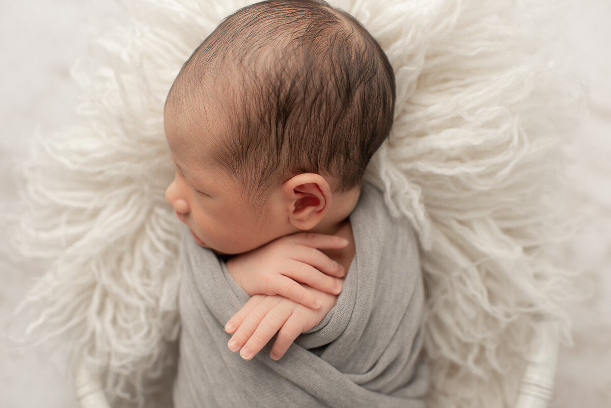 Baby boy in gray, close up of side profile in white crib | Sharon Leger Photography | CT Newborn & Family Photographer | Canton, Connecticut