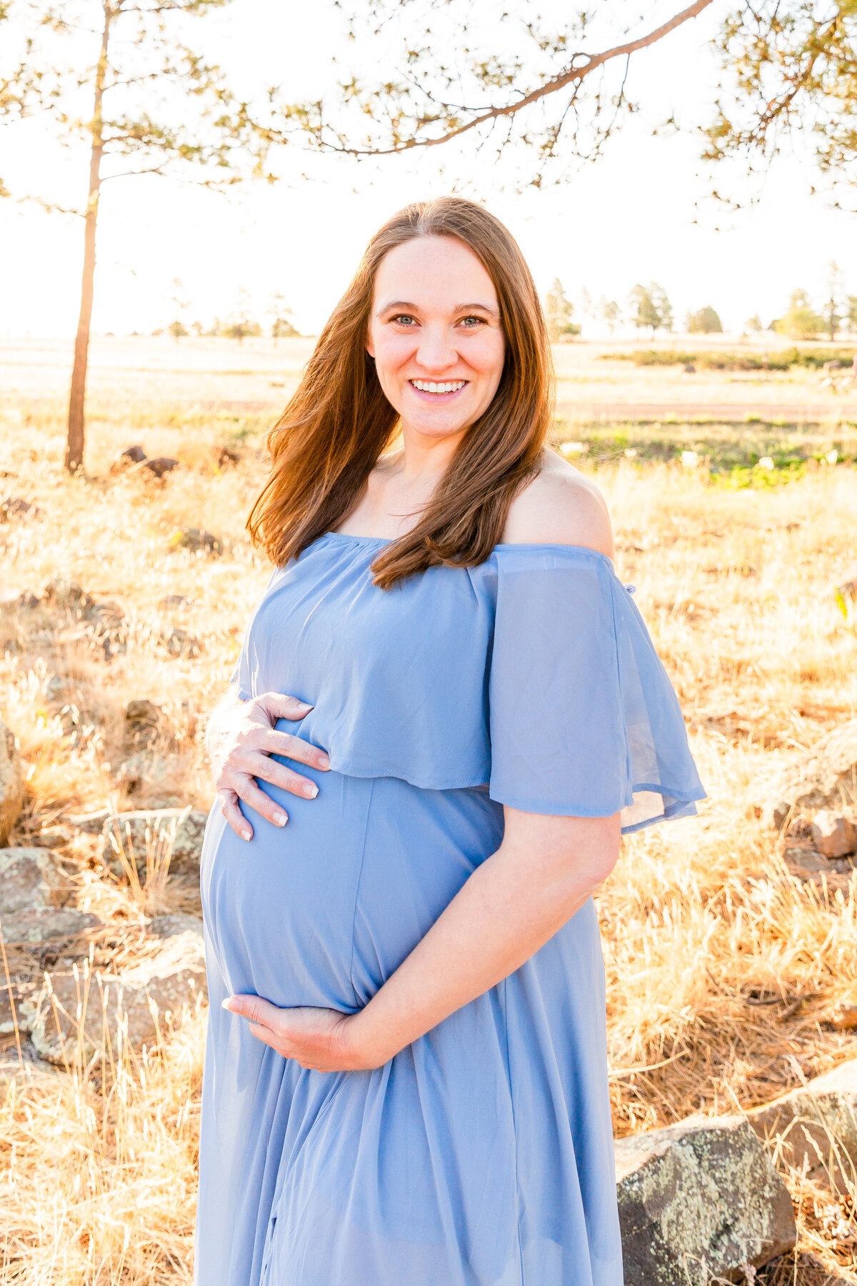 Smiling mama during a maternity photo session in Flagstaff, Arizona