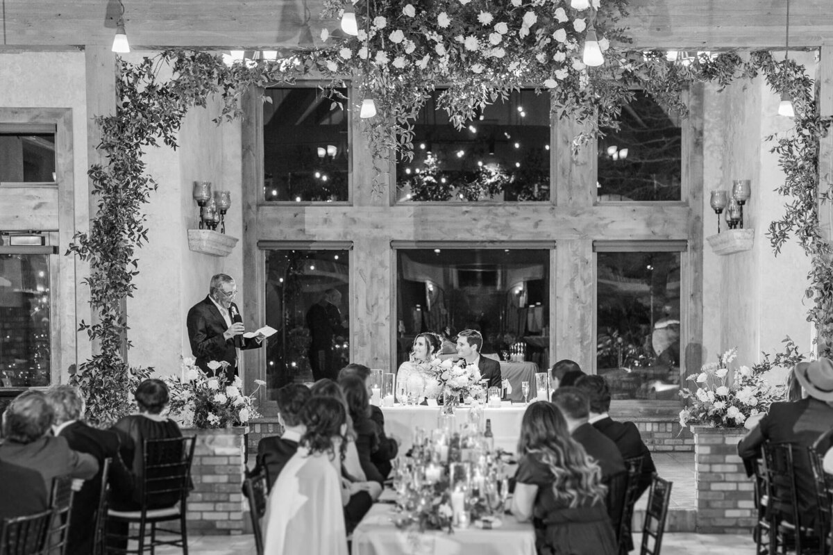 Father of the bride gives a toast during the wedding reception at Della Terra Chateau in Estes Park.