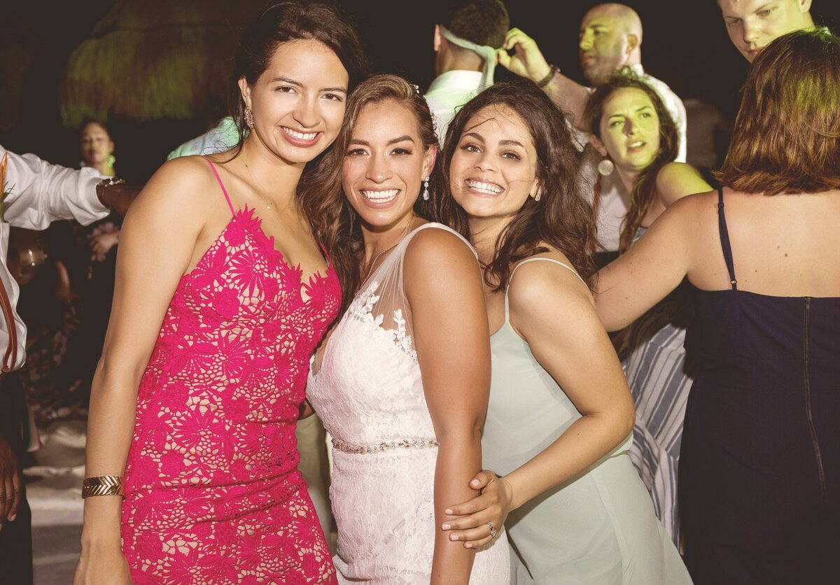 Bride with guests at wedding reception in Cancun