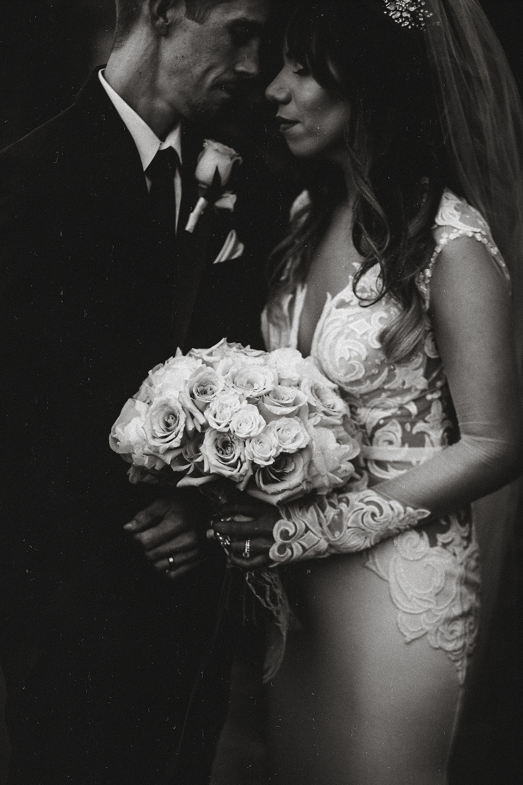 Wedding Photograph Of Bride Carrying a  Bouquet Next To Her Groom Black And White Los Angeles