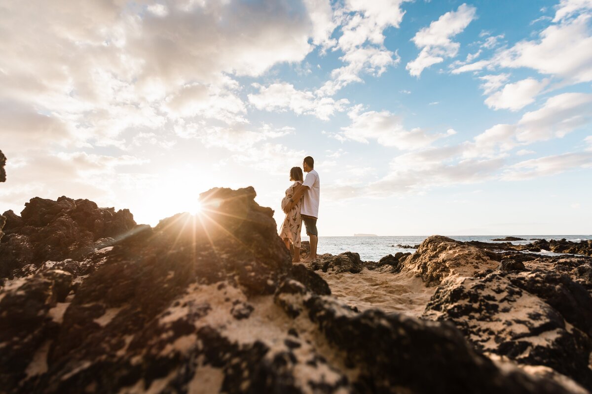 Couple at makena cove beach for a maternity photography session with moorea thill