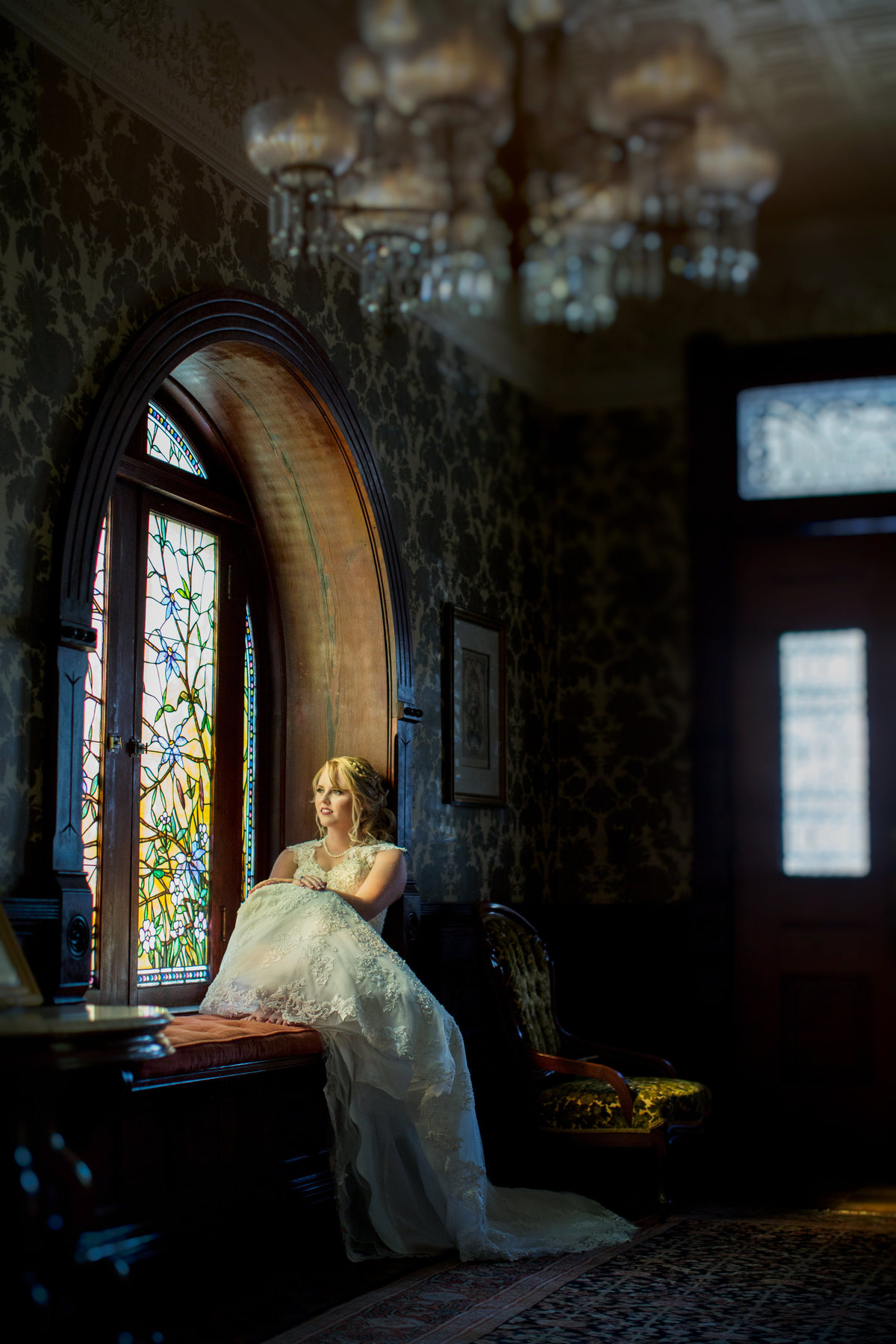 Austin wedding photographer chateau bellevue wedding photographer bride sitting in window