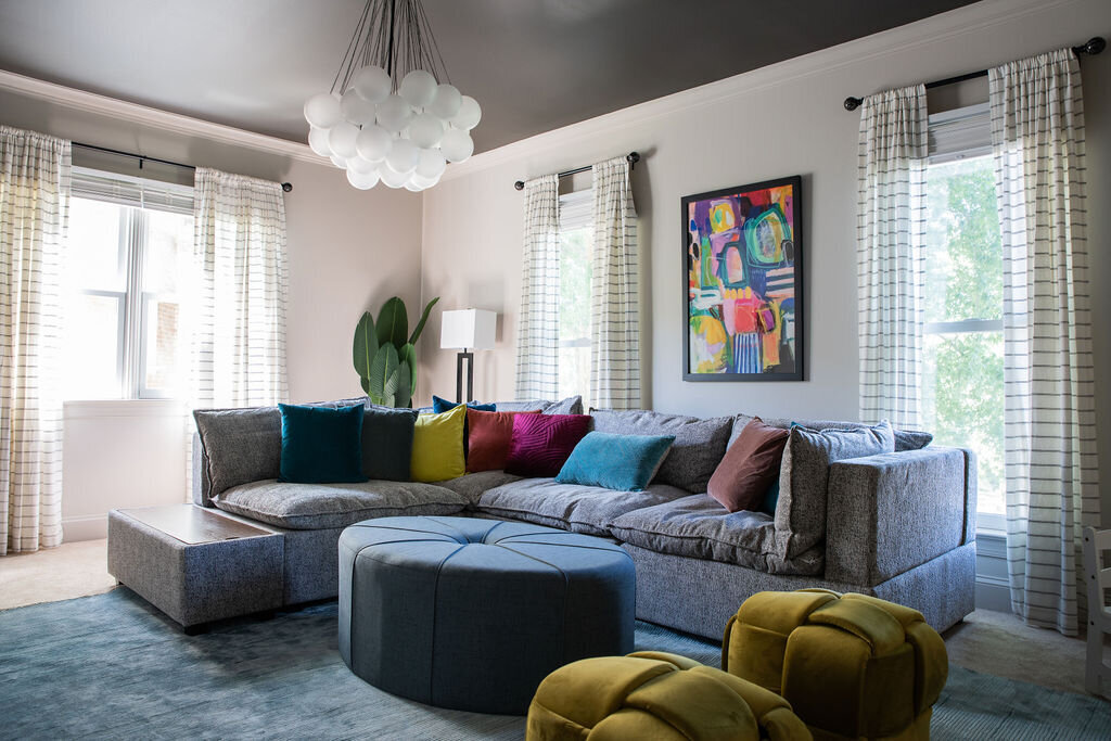 colorful furniture and artwork in a media room