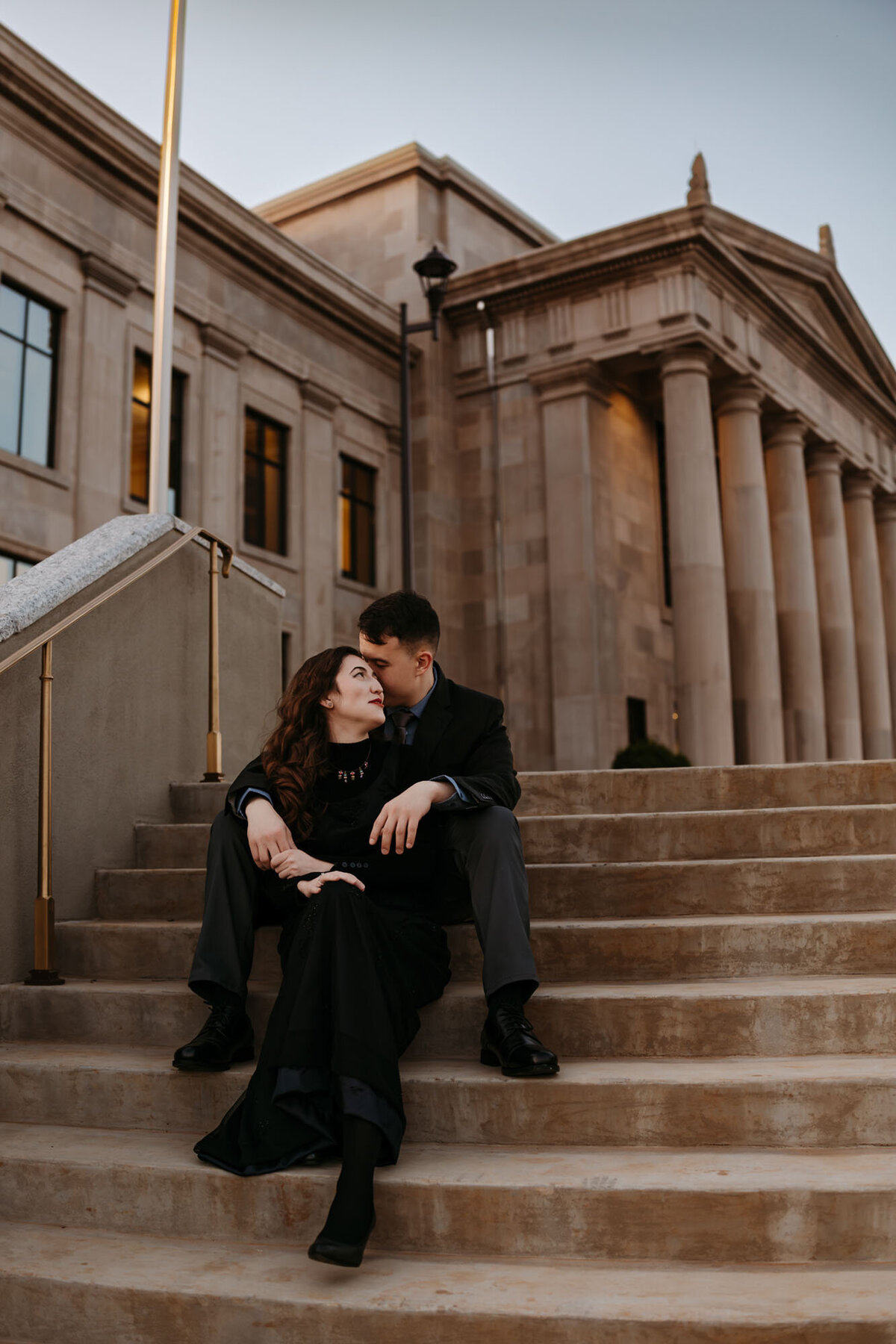 couple-sitting-at-courthouse-Orange-Rose-Photography