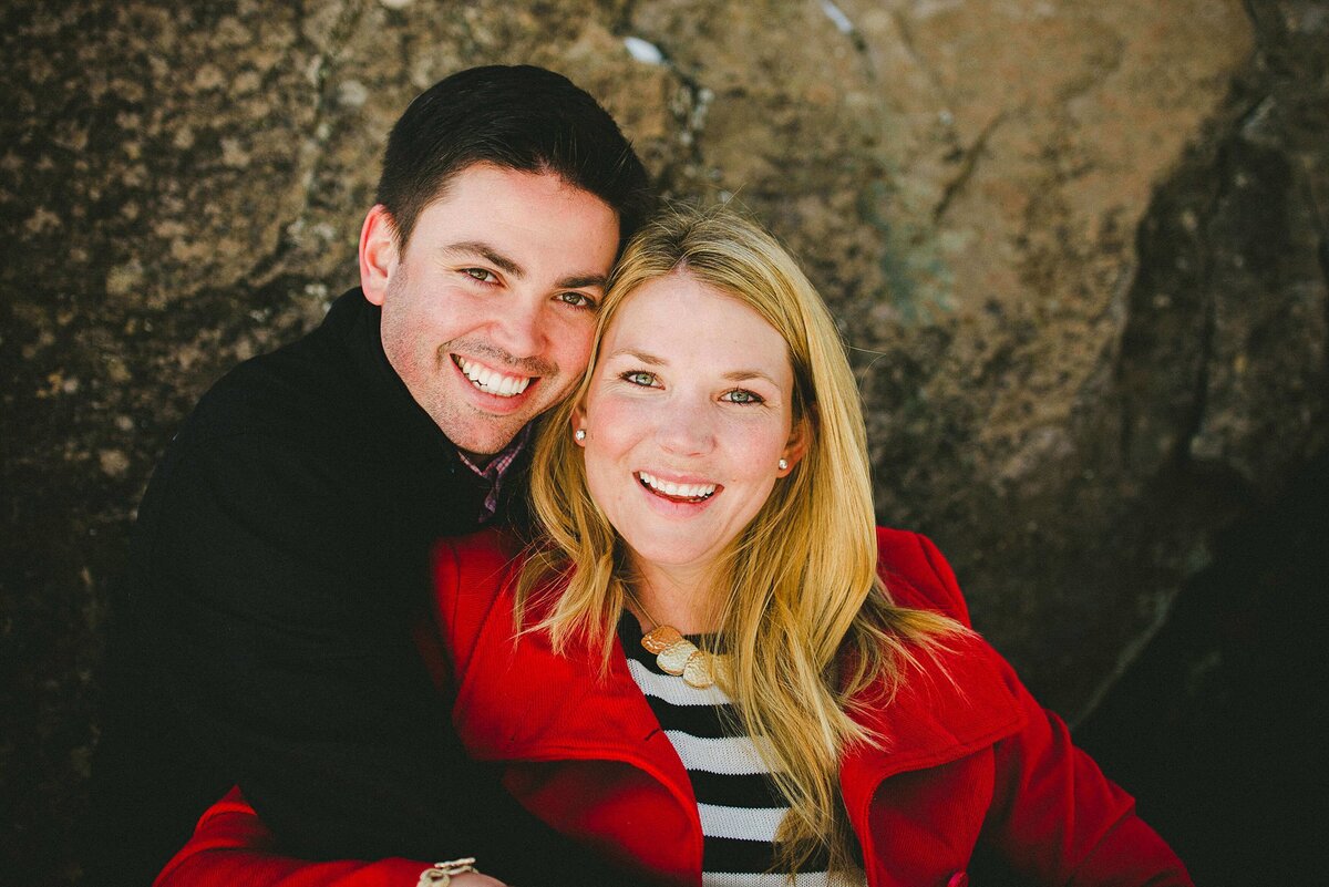 engagement truckee couple looking at camera, hugging