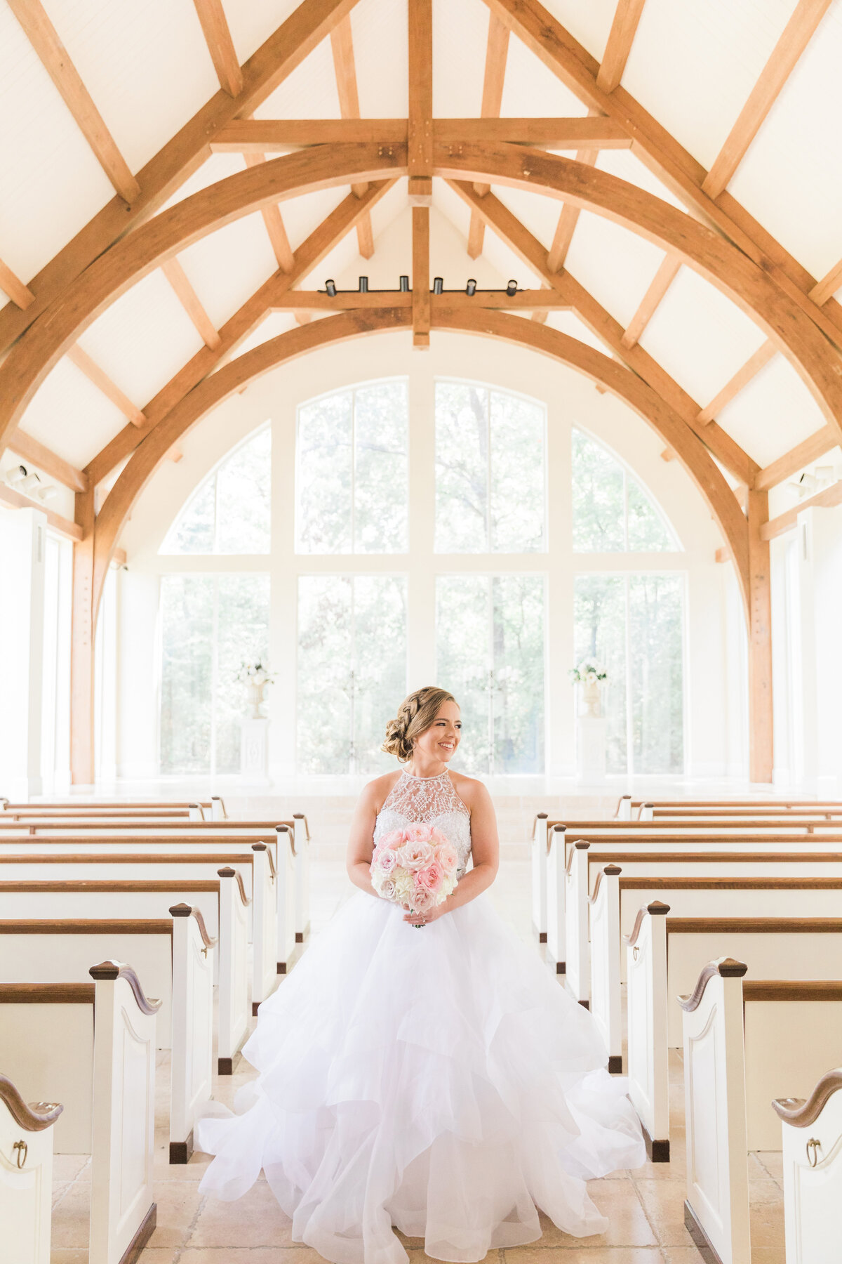 A bride in the chapel at Ashton Gardens North Houston
