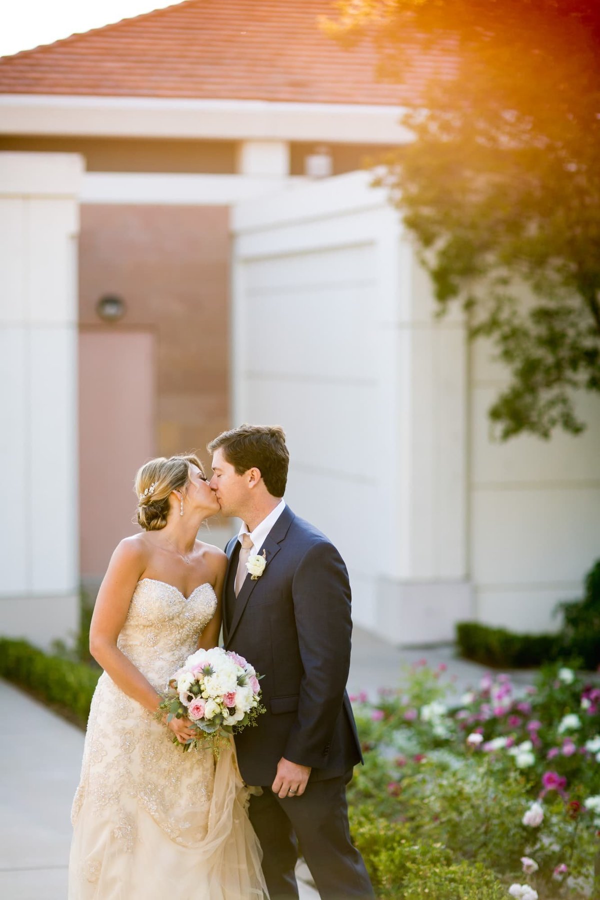 Bride and Groom share a kiss during their wedding shoot