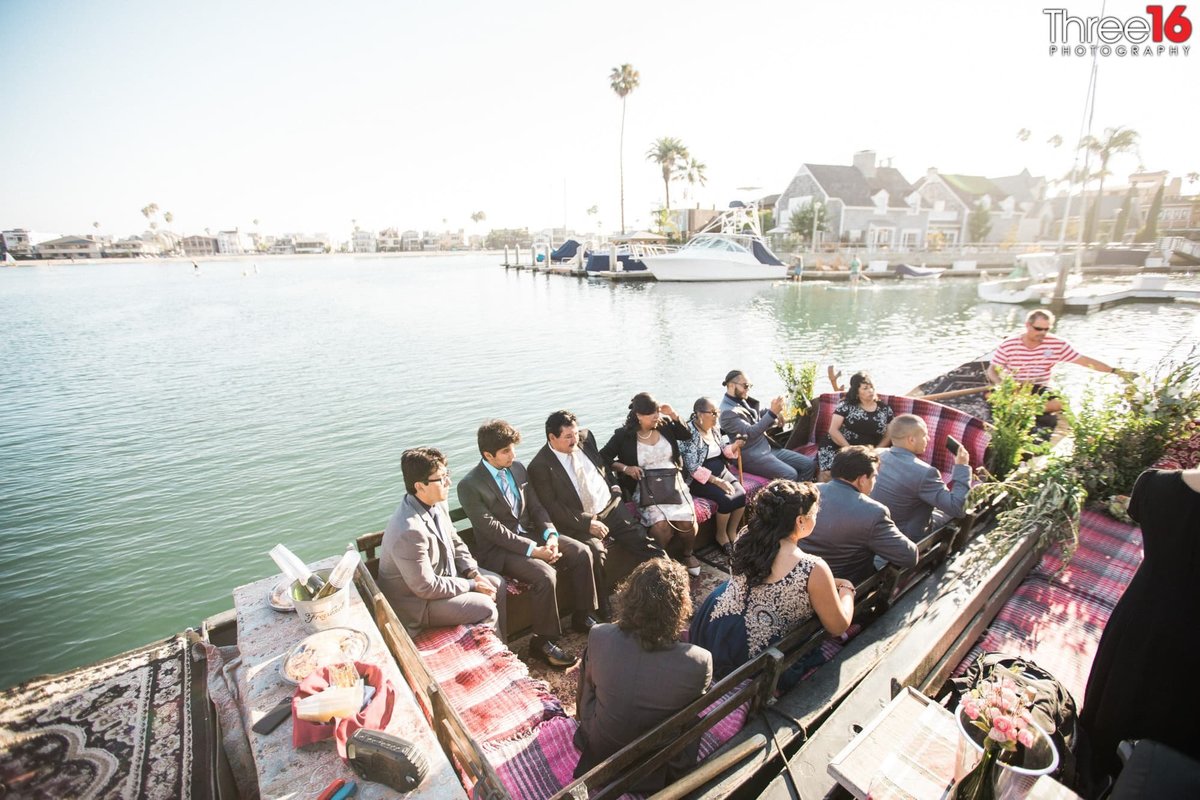 Guests sitting in a gondola waiting the Bride and Groom