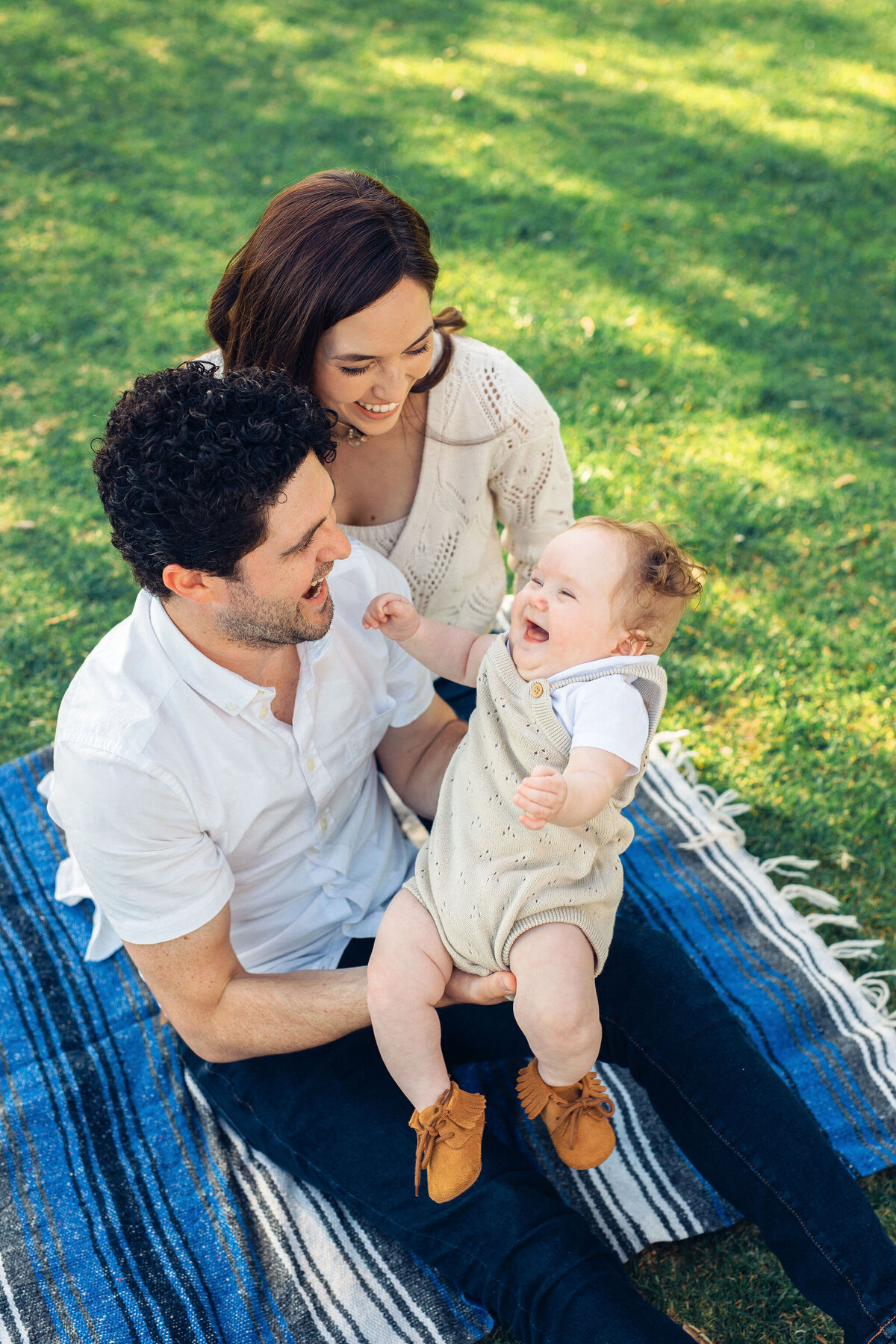 Family Portrait Photo Of Couple Laughing With Their Baby In Los Angeles