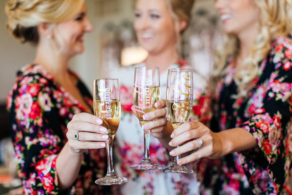 Baltimore-Wedding-Photographer-Bridesmaids-Cheersing-Champagne-Robes
