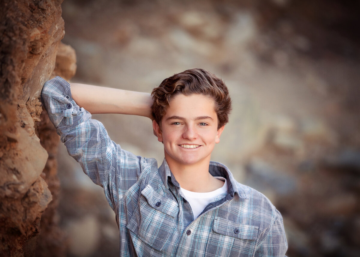 senior-teen-guy-rocks-nature-gorgeous-ccasual-flannel