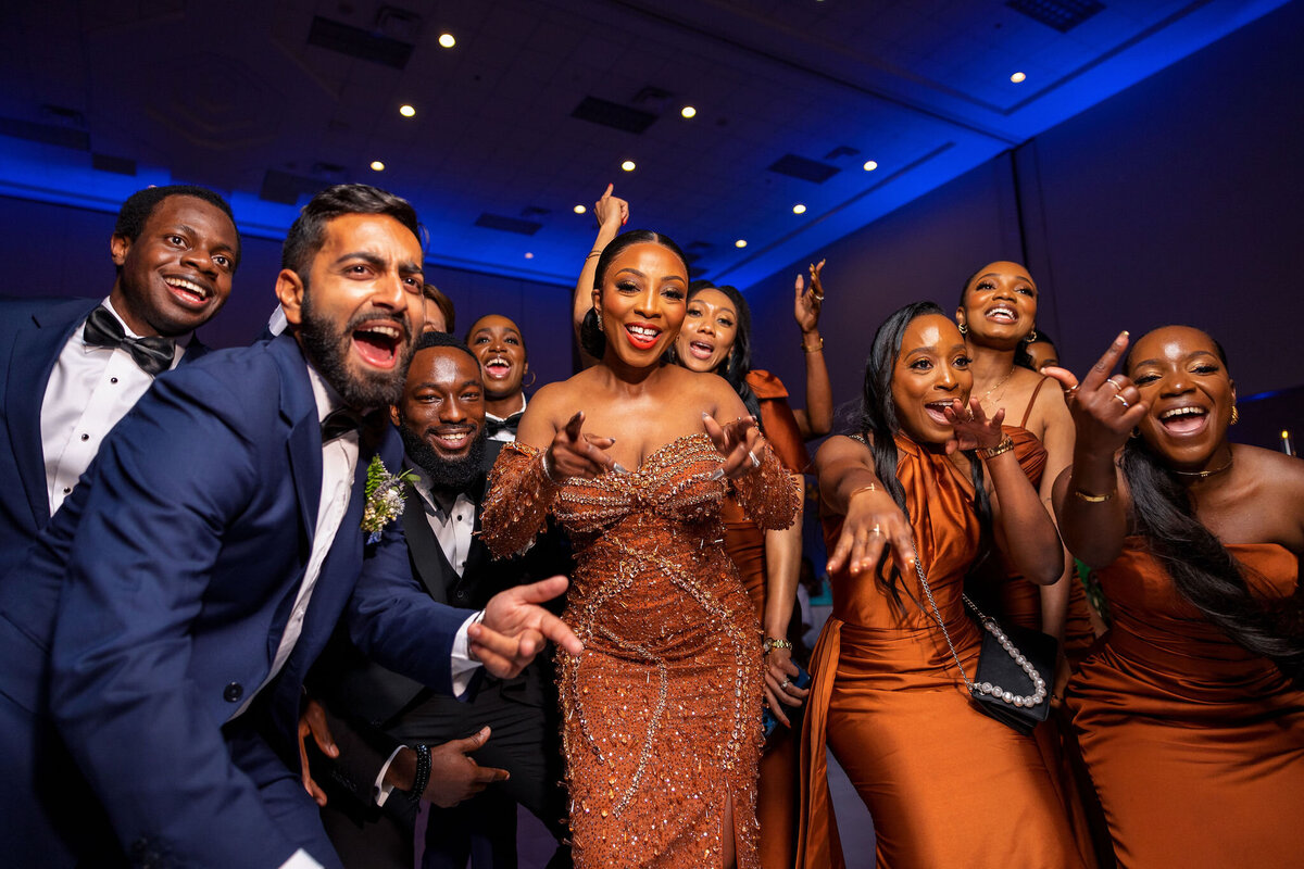 Tomi and Tolu Oruka Events Ziggy on the Lens photographer Wedding event planners Toronto planner African Nigerian Eyitayo Dada Dara Ayoola ottawa convention and event centre pocket flowers Navy blue groom suit ball gown black bride classy  215