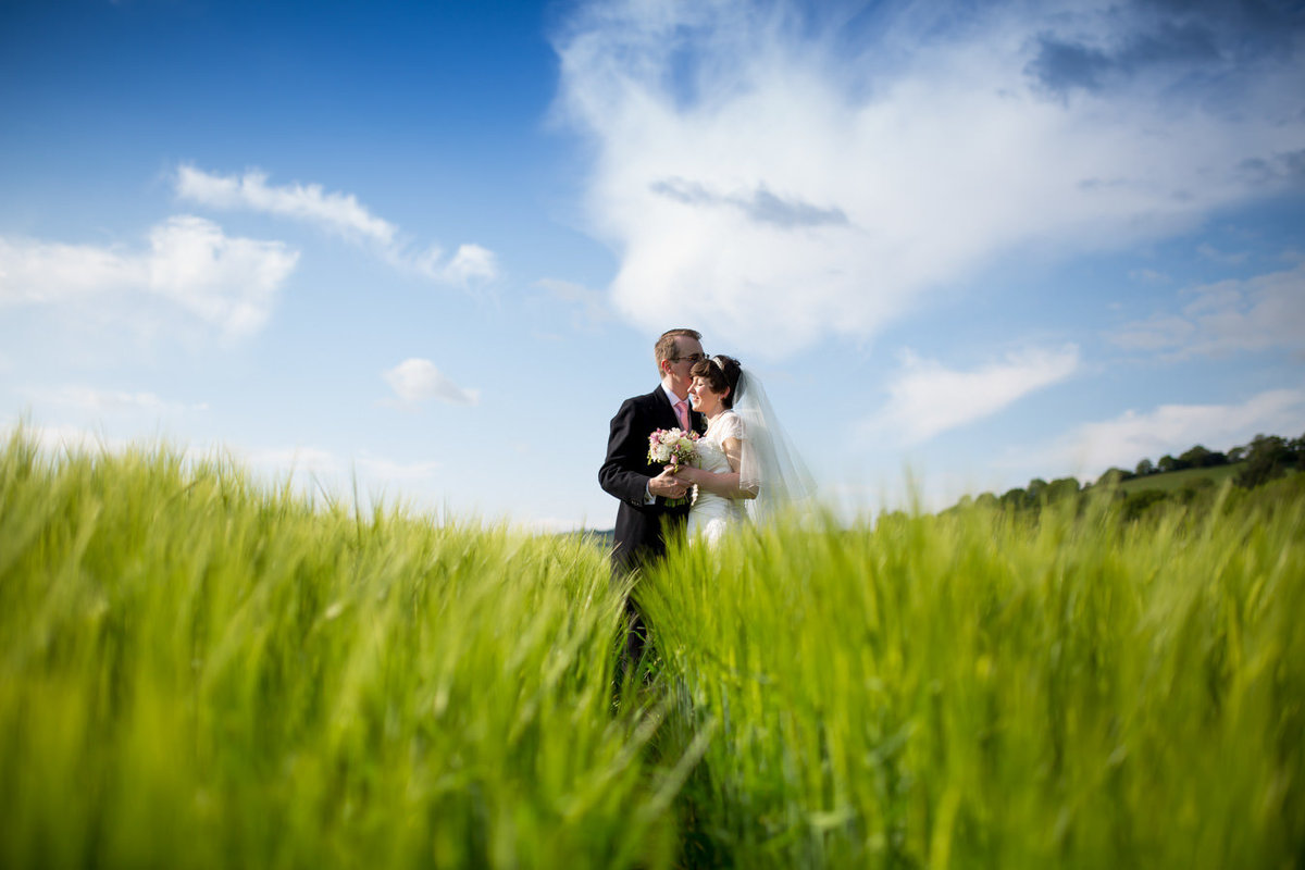 Rural wedding of a couple in a Devon field