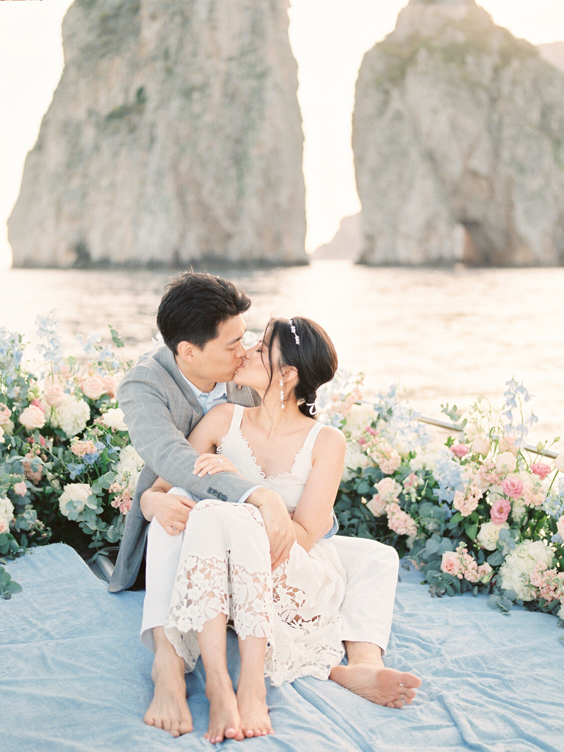 Kissing in front of Capri Faraglioni