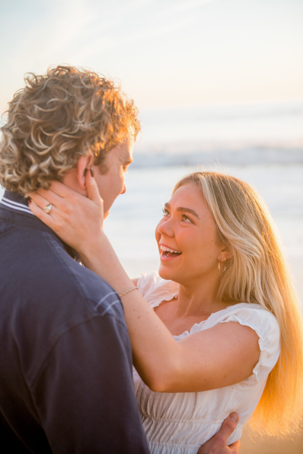 happy couple during sunset for their engagement photos in san diego by wedding photographer mattie taylor