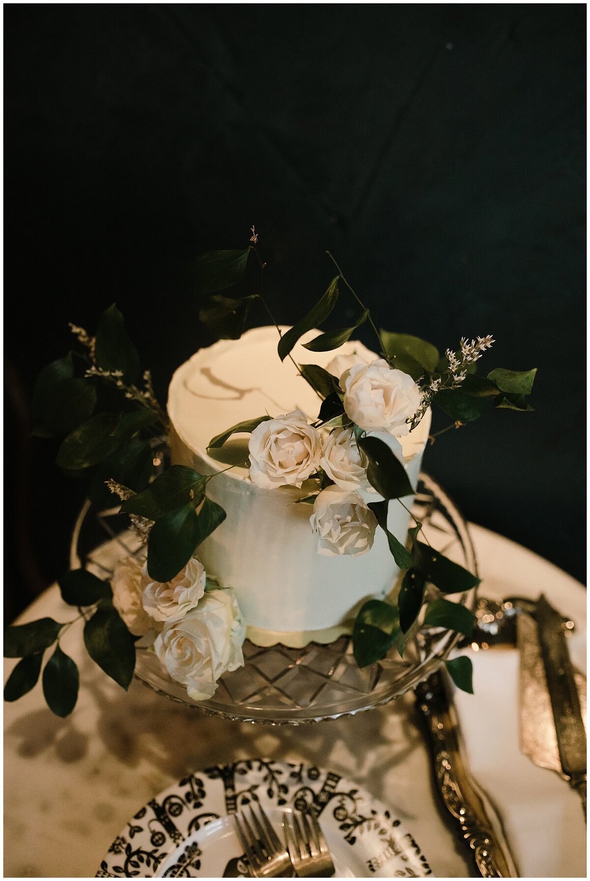 Wedding cake decorated with white florals for Hotel Saint Cecilia elopement wedding
