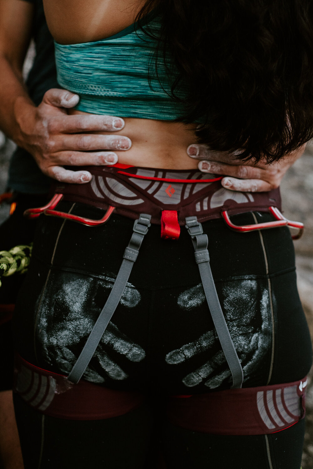 Detail shot of chalk hands on bum after climbing engagement session in Squamish