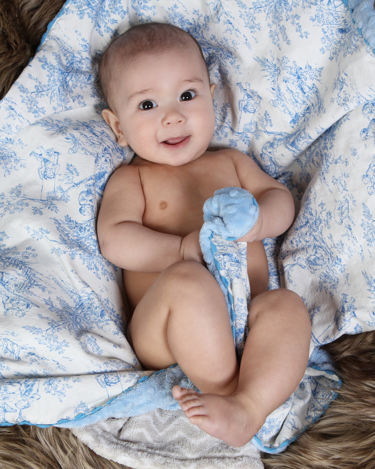 Newborn on blanket indoor photo session