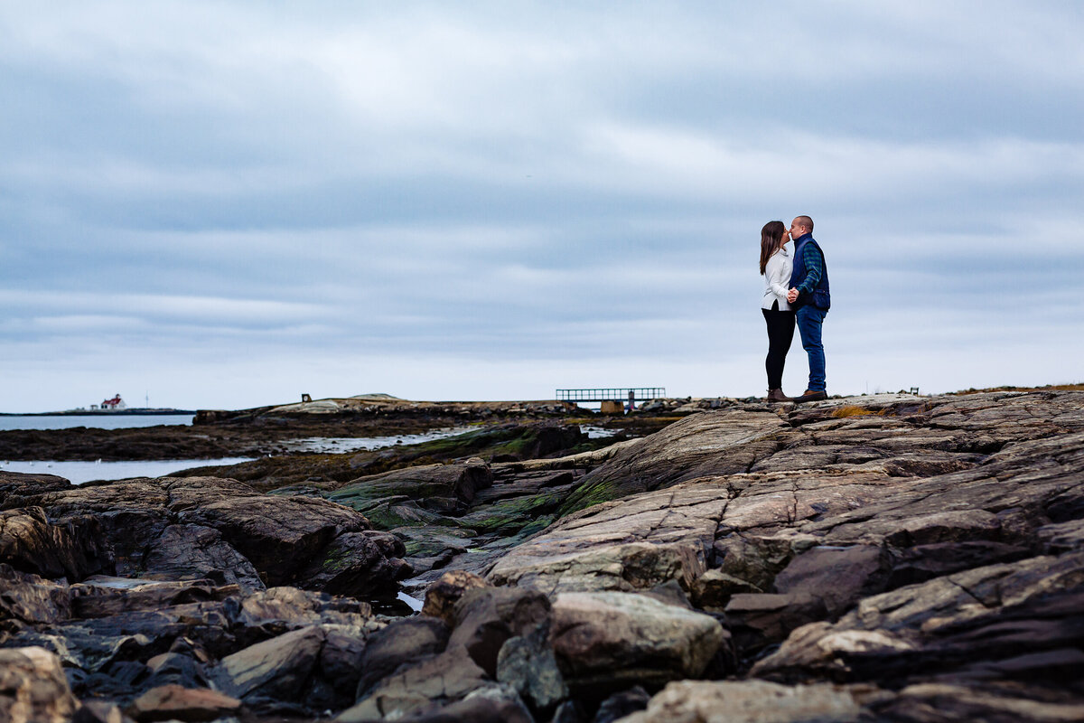 Great Island Common New Castle NH engagement session kissing out on the rocks