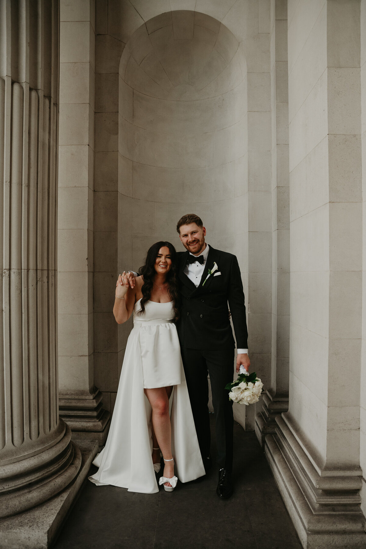 Bride and groom in the alcove of The Old Marylebone Town Hall. 