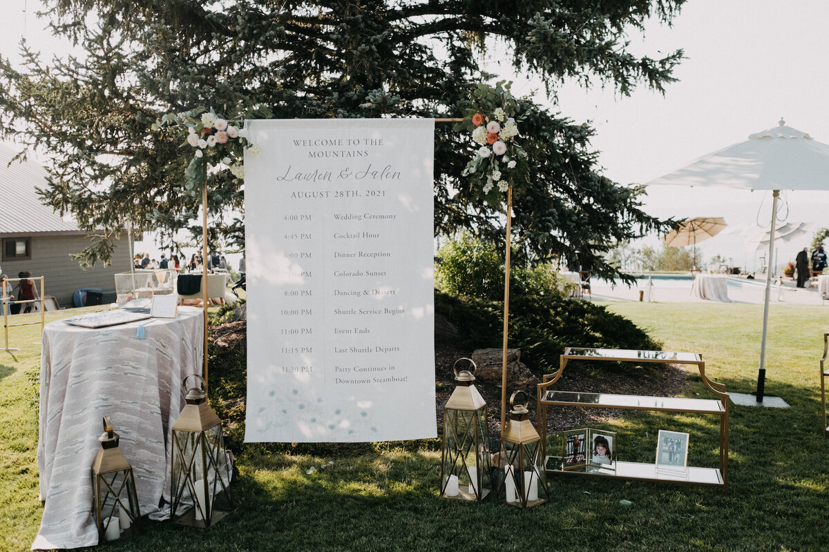 Large welcome fabric banner for a wedding, with welcome table