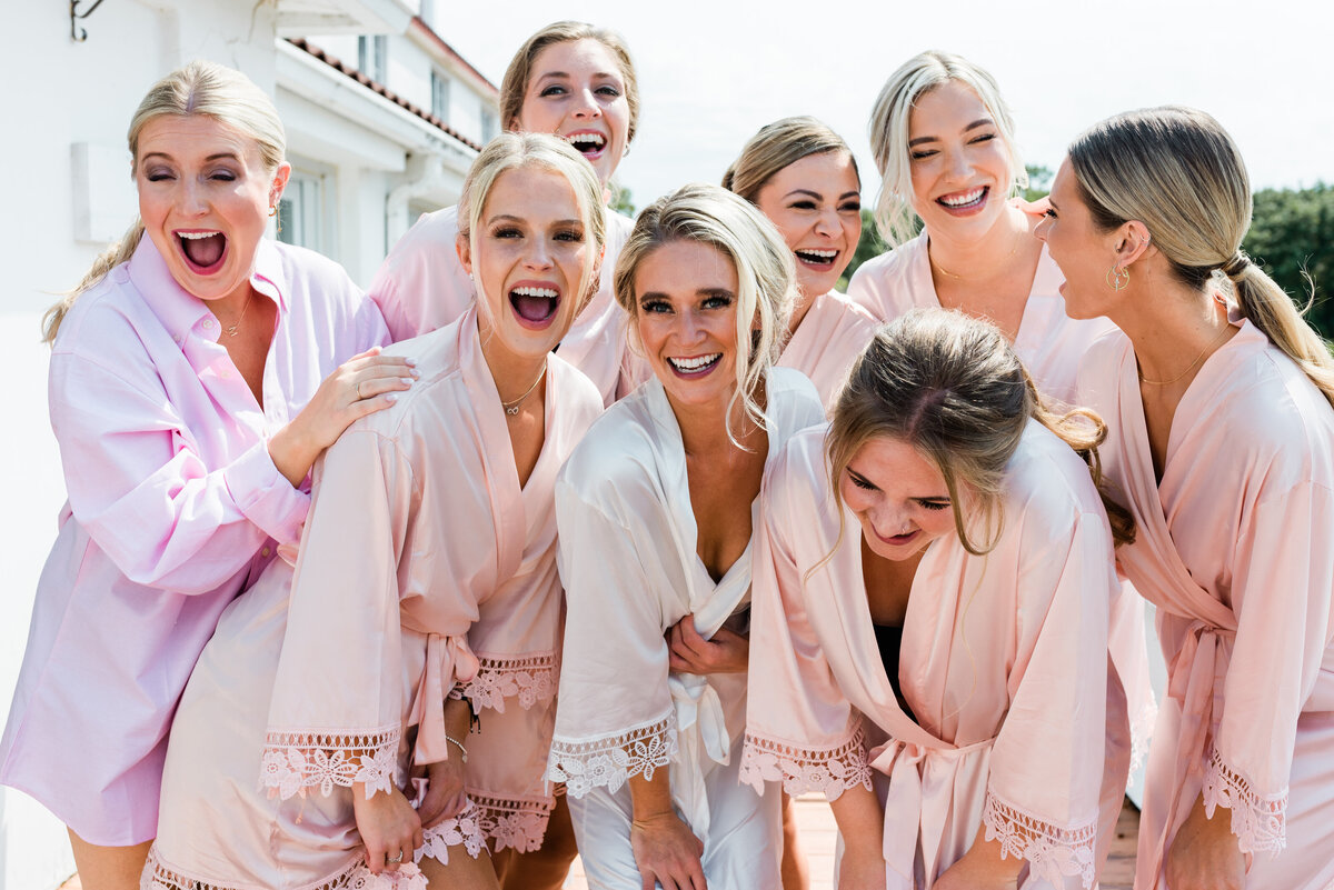 Bridesmaids smilling and laughing in pajamas