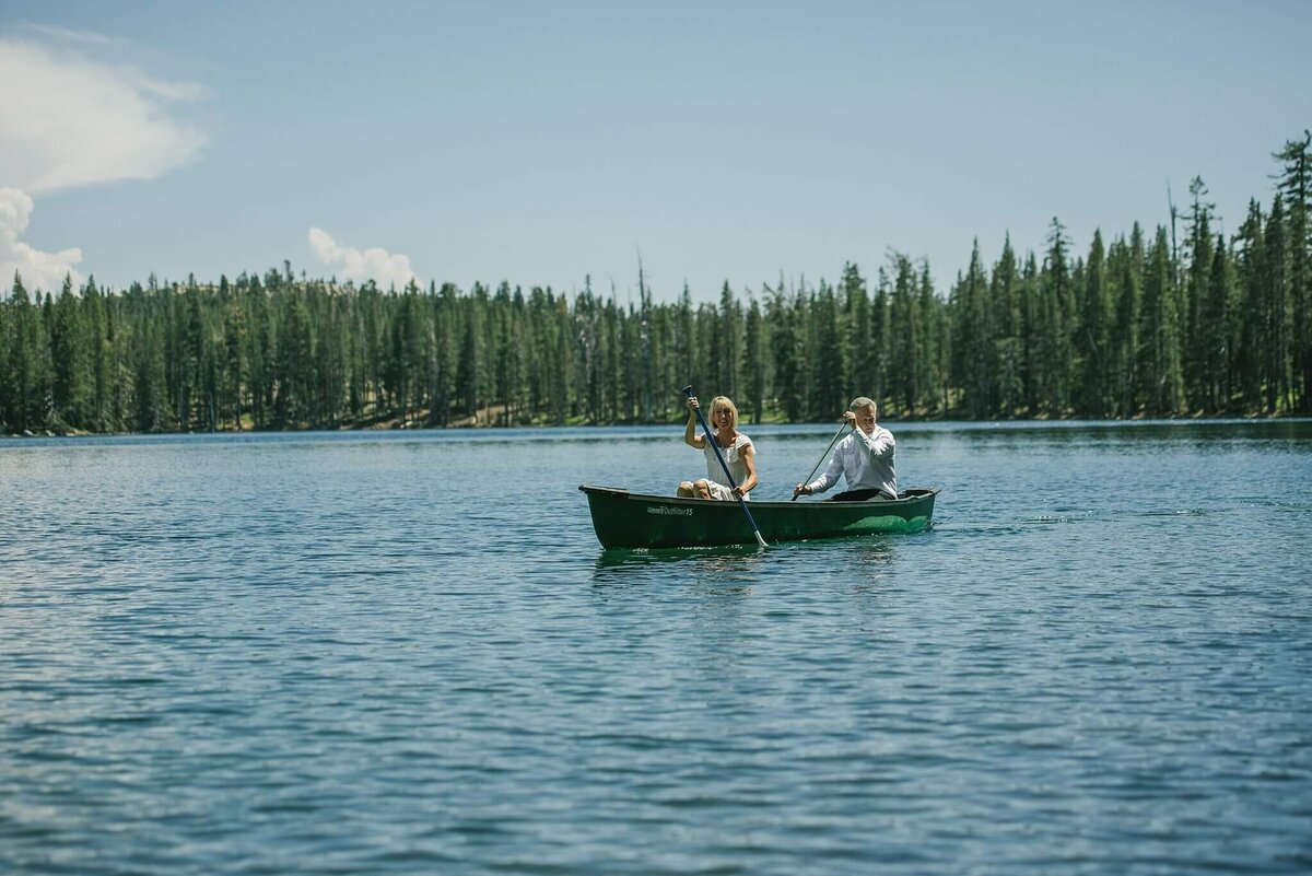 couple in canoe in soda springs after wedding ceremony
