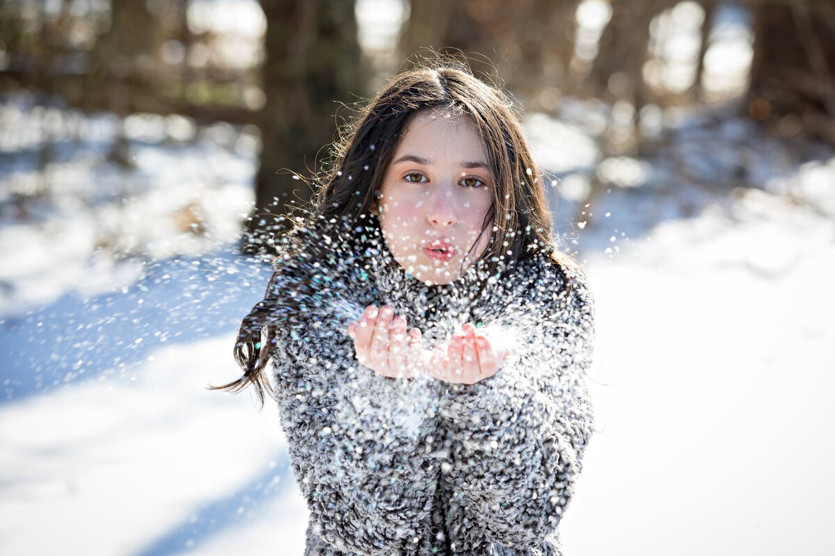 bat-mitzvah-winter-preshoot-girl-blowing-snow-nj