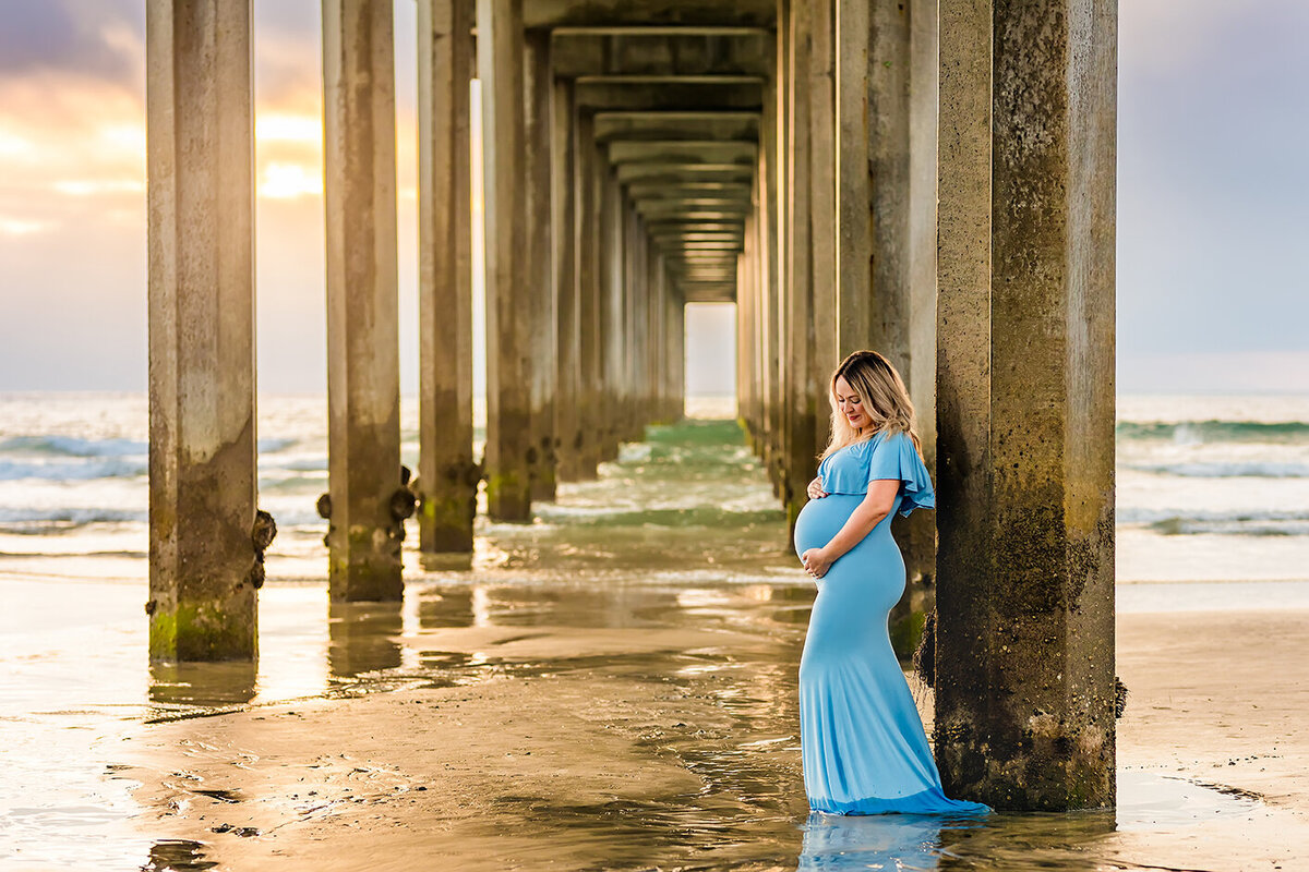 Portrait of pregnant woman under Scripps Pier