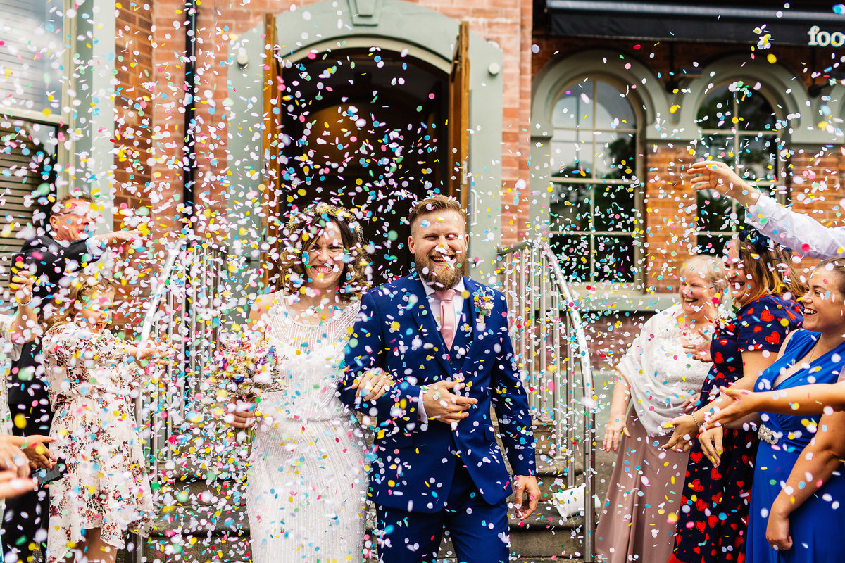 Bride and groom confetti photo outside The Faversham in Leeds