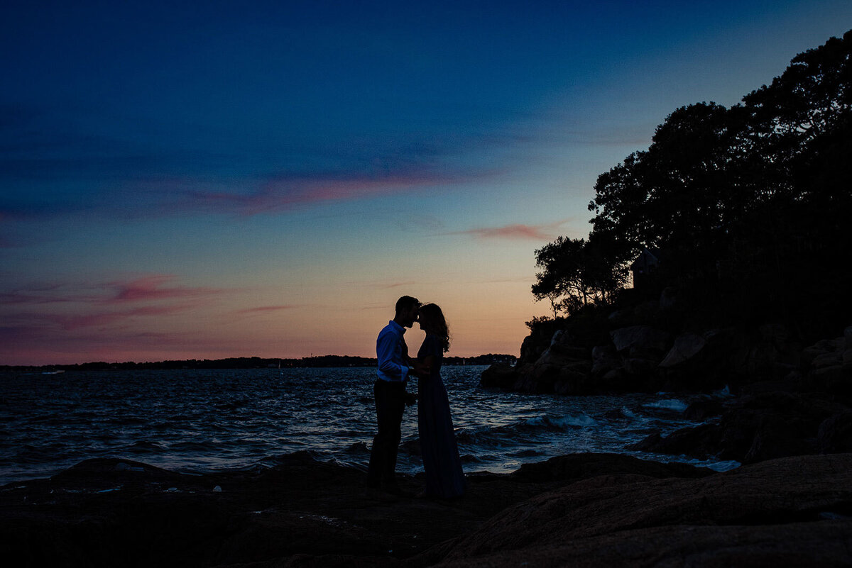 silhouette of couple at sunset by ocean misselwood endicott college