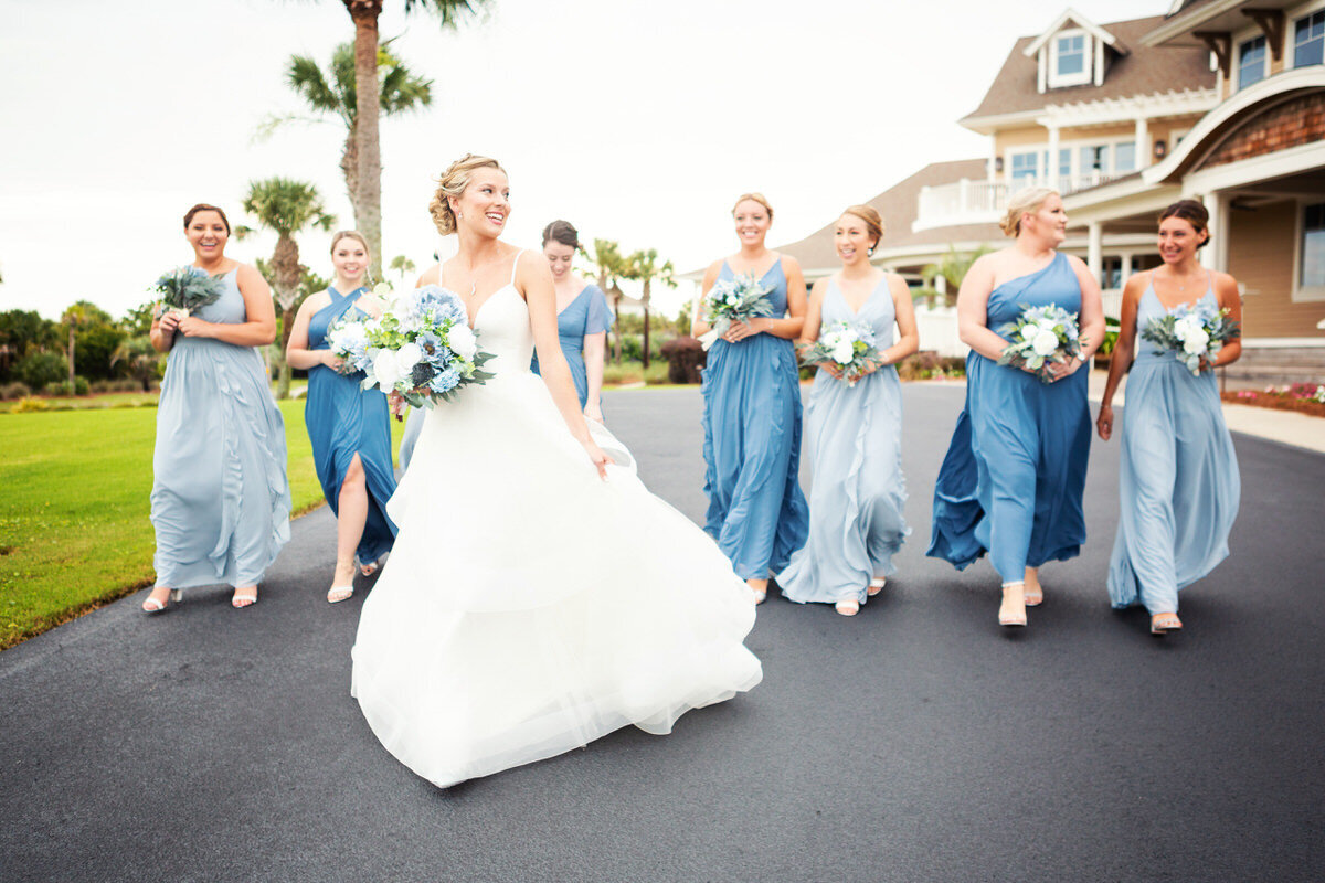 Bride walking with bridesmaids at Seabrook Island Club Charleston Wedding Photographer