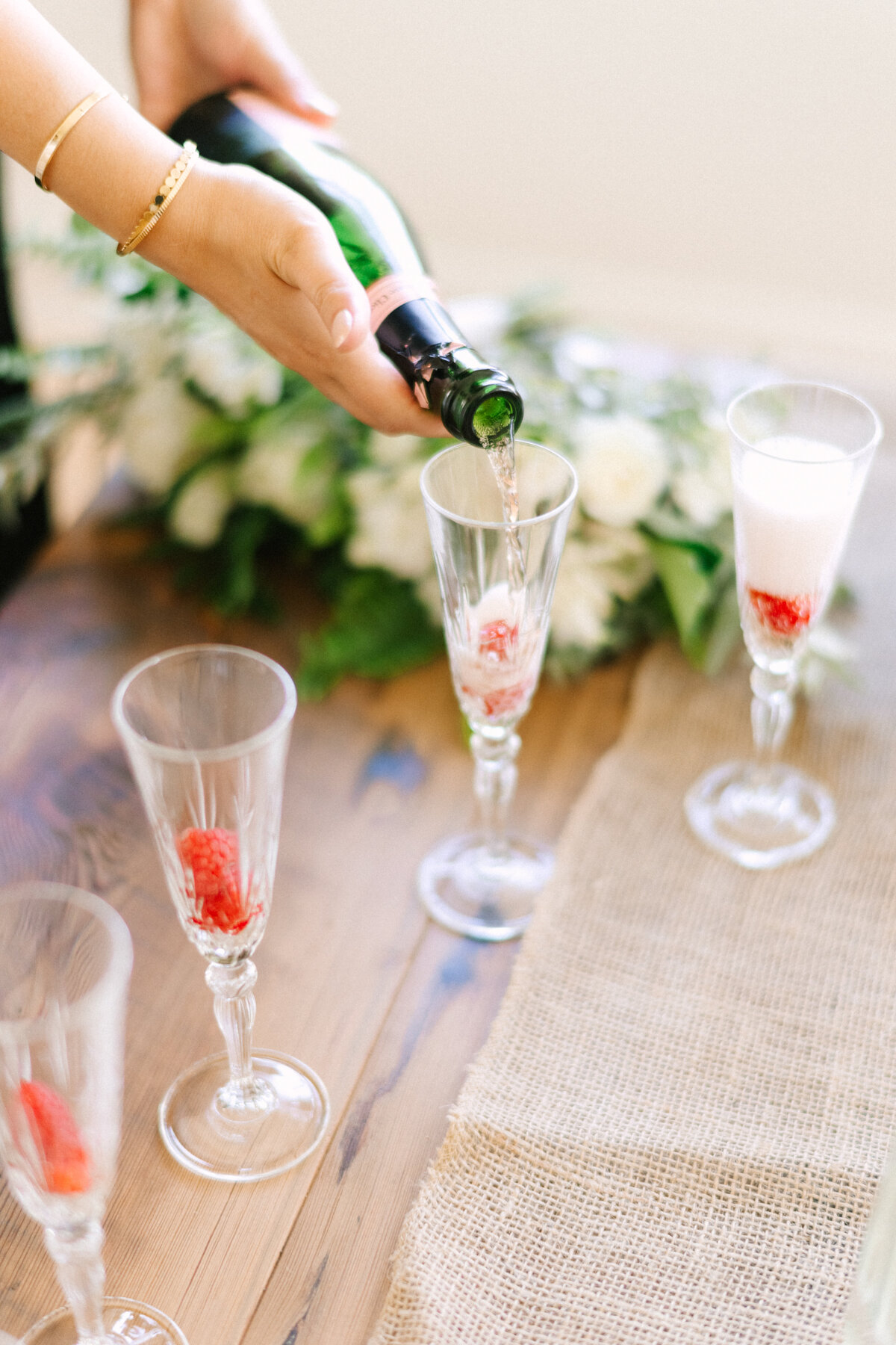 celebratory champagne being poured for wedding day toast