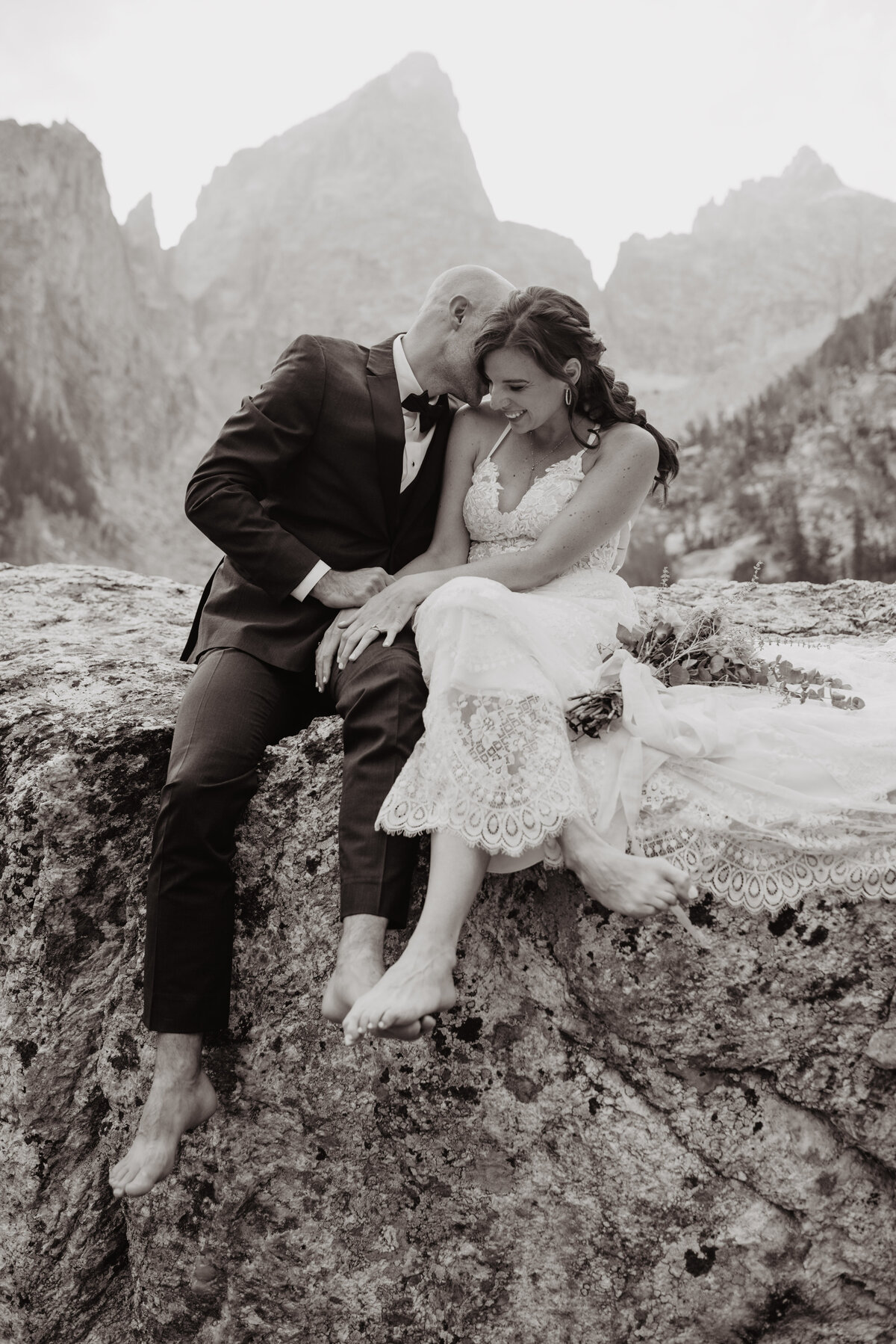 Jackson Hole Photographers capture groom kissing bride's hair