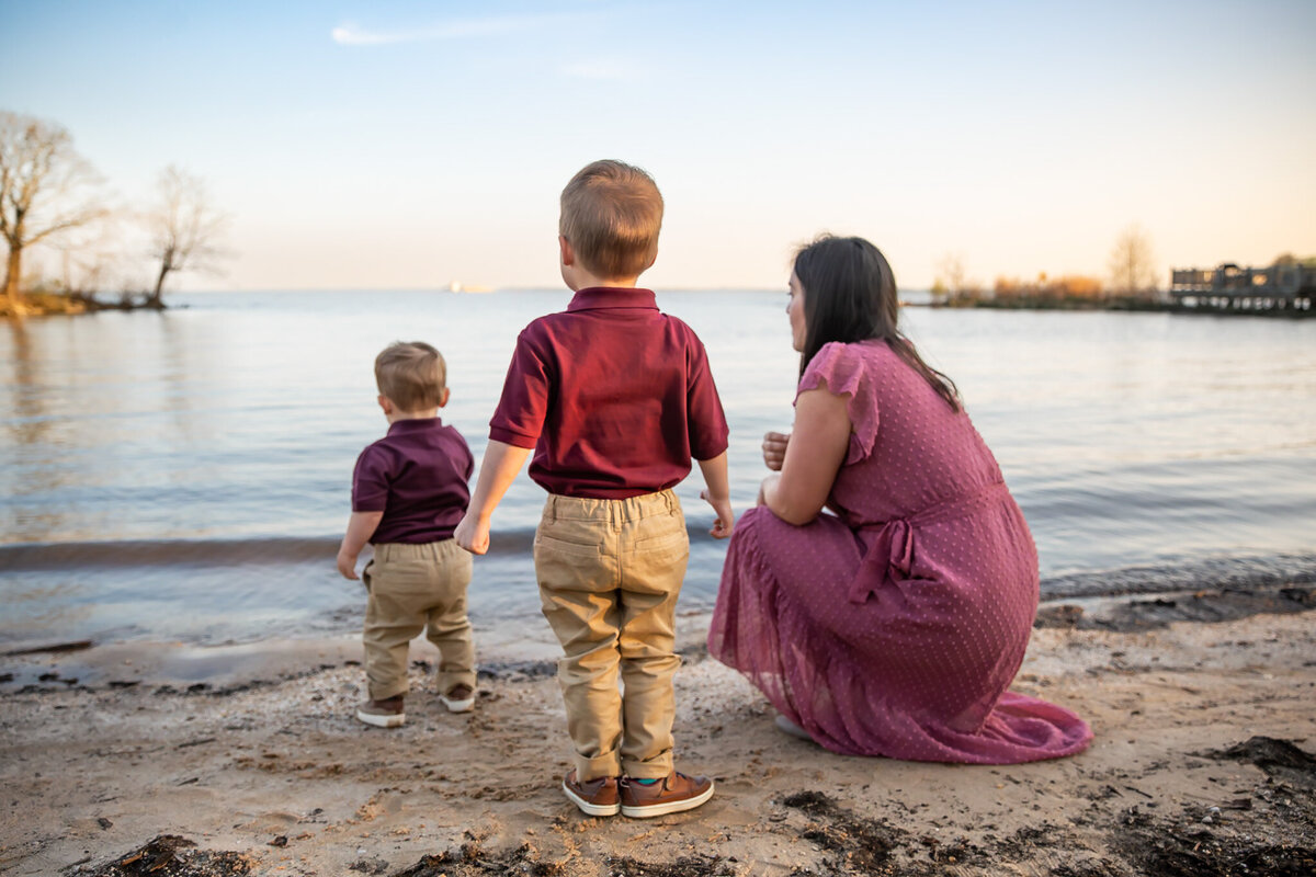 A Baltimore County Mother looks out into the water with her two sons near the Havre de Grace Promenade