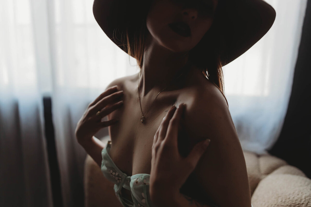 close up image of collar bone with delicate fingers on the shoulders