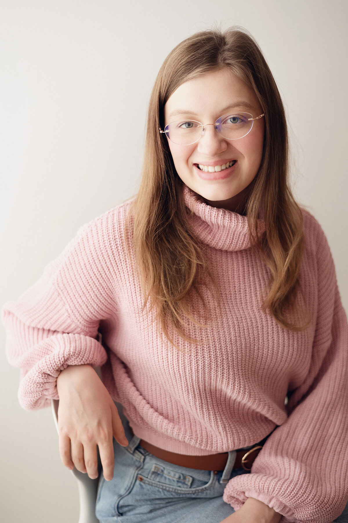 woman in pink sweater smiling