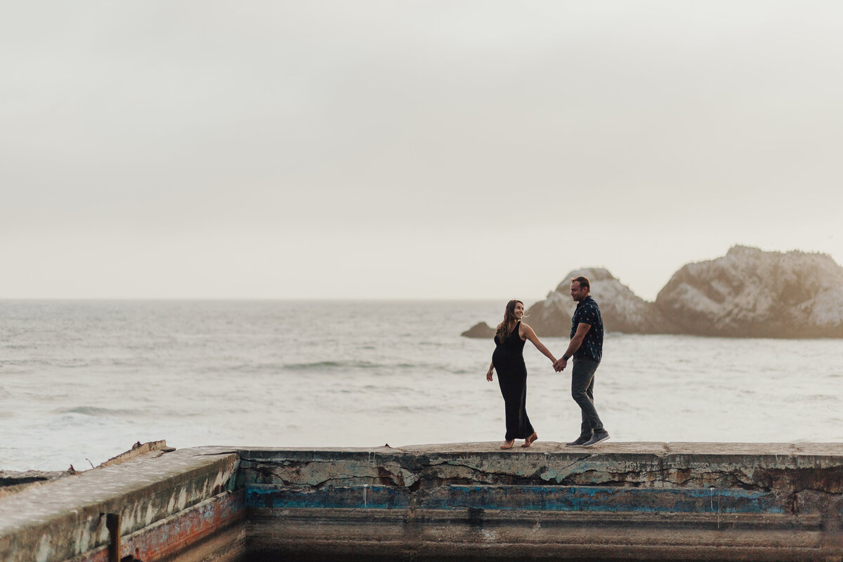 Mom and Dad walk at Sutro Baths Emily Woodall Photography