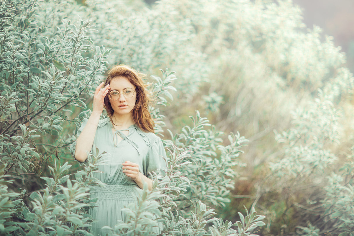 Portrait Photo Of Young Woman In Green Dress In The Middle Of Trees Los Angeles